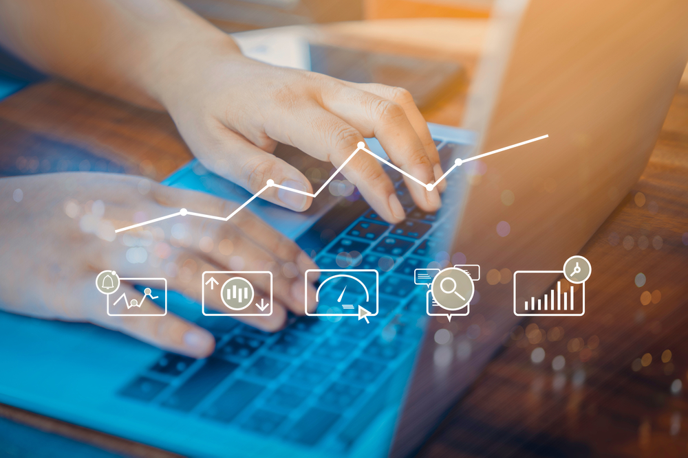 Person,Using,A,Laptop,Computer,With,Digital,Marketing,Technology,Concept.